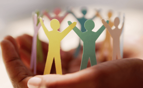 Hands holding paper cutouts