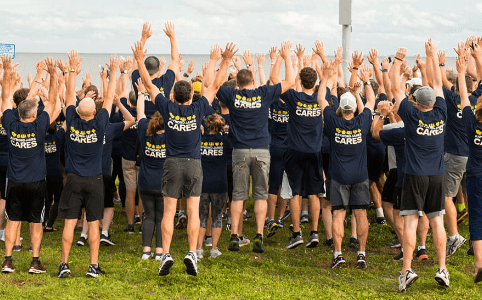 group-jumping-with-hands-up-ca-foundation-banner