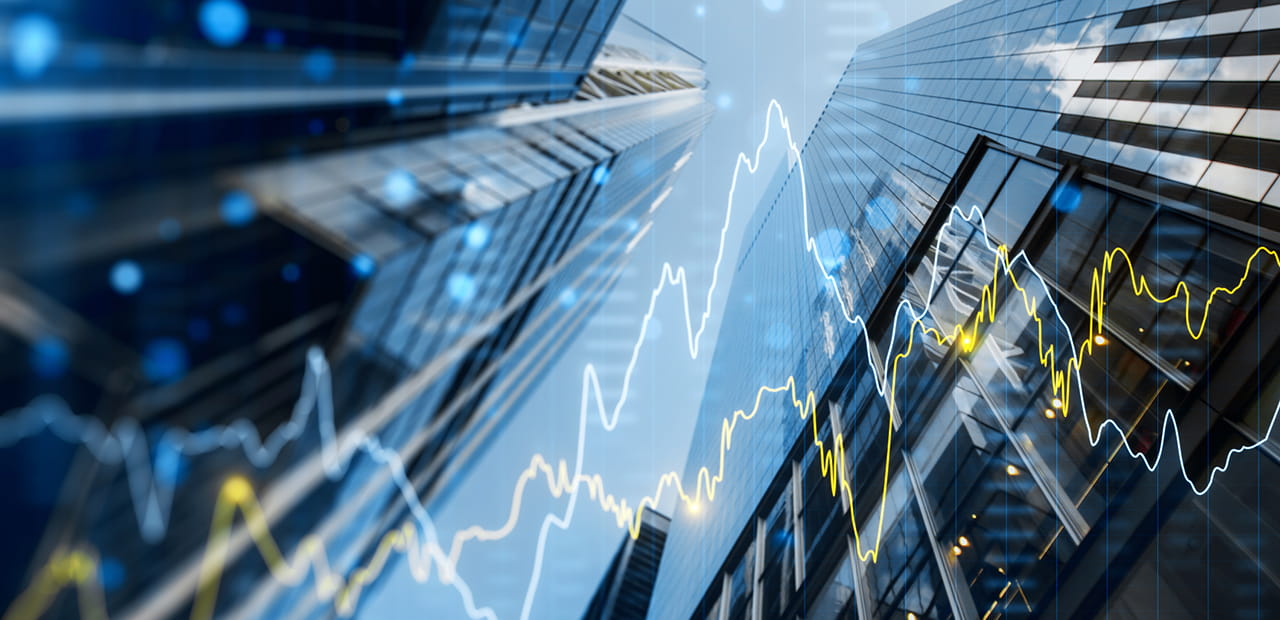 A double exposure image of skyscrapers with overlay of financial graph