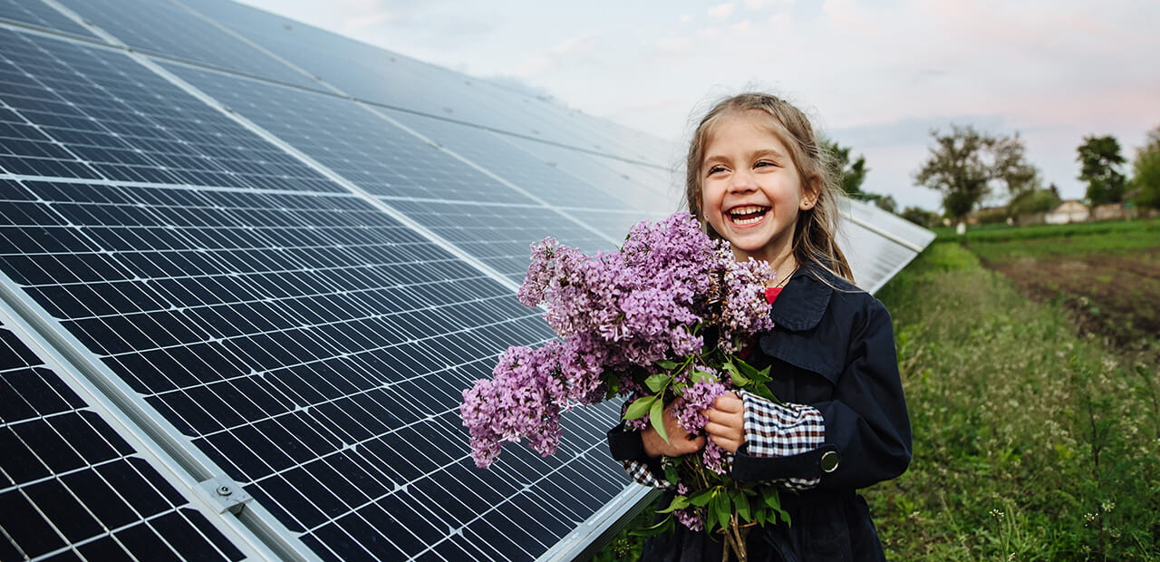 little girl holding flowers