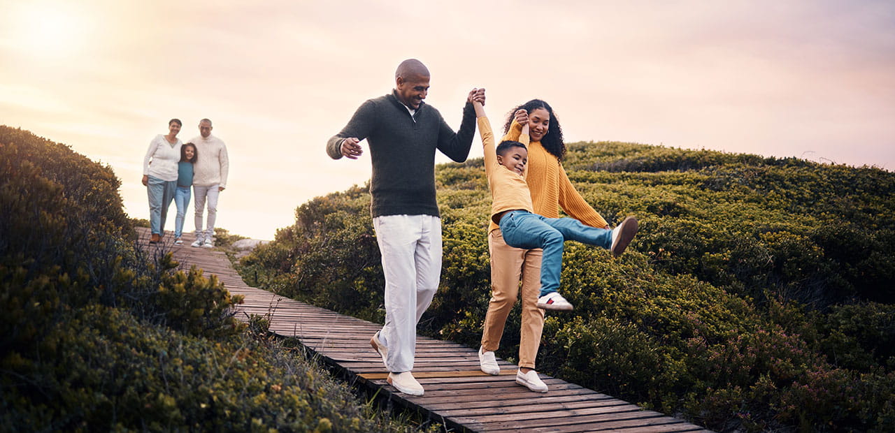 Children and grandparents spending time together in nature. 