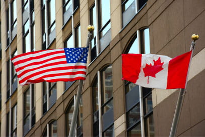 United States and Canadian flags.