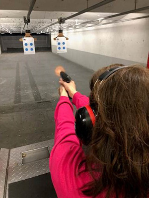 Maria at a gun range