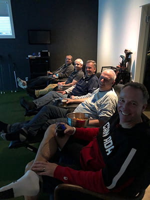 Friends sitting down watching the Super Bowl