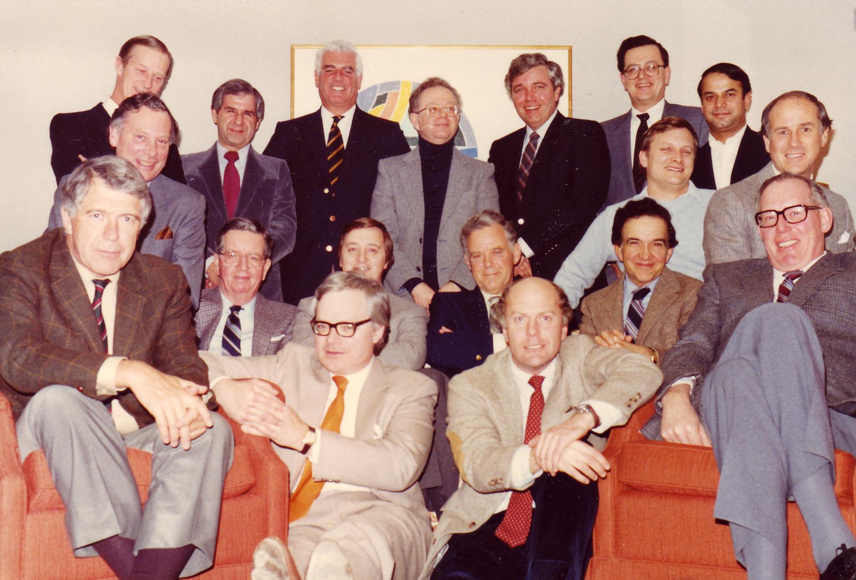 a group photograph of 18 men