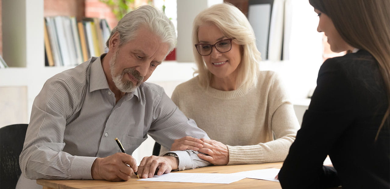 an elderly couple with an advisor