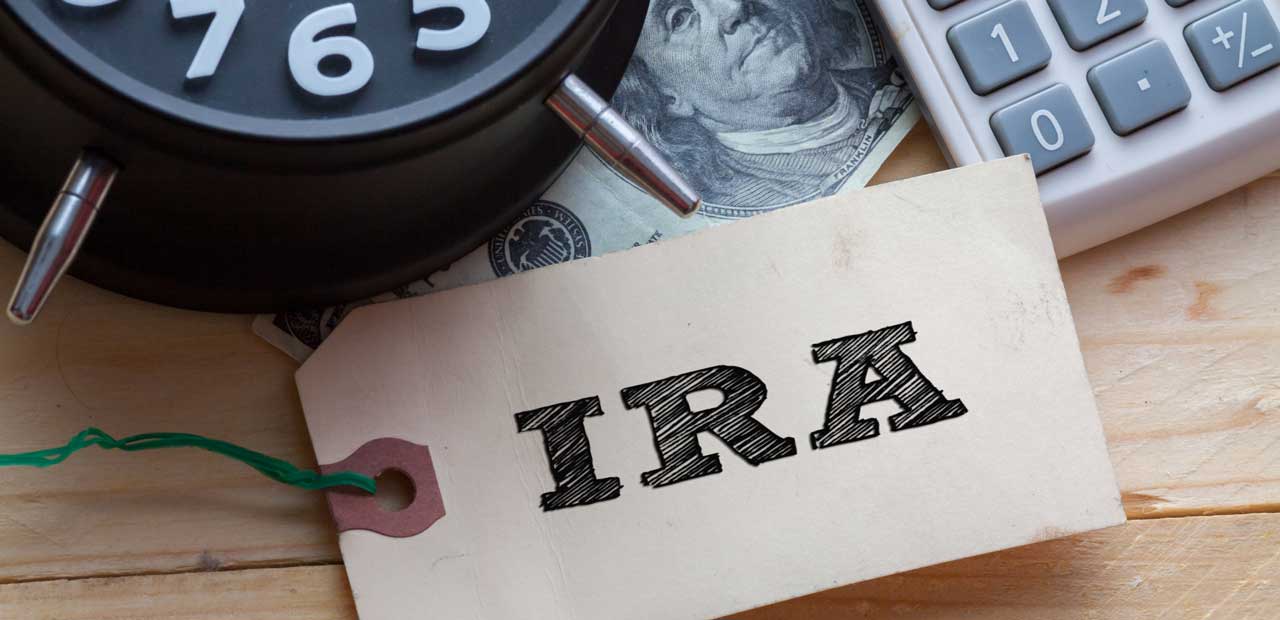 IRA Word on tag with a clock, a dollar note and a calculator