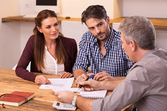 couple talking to man