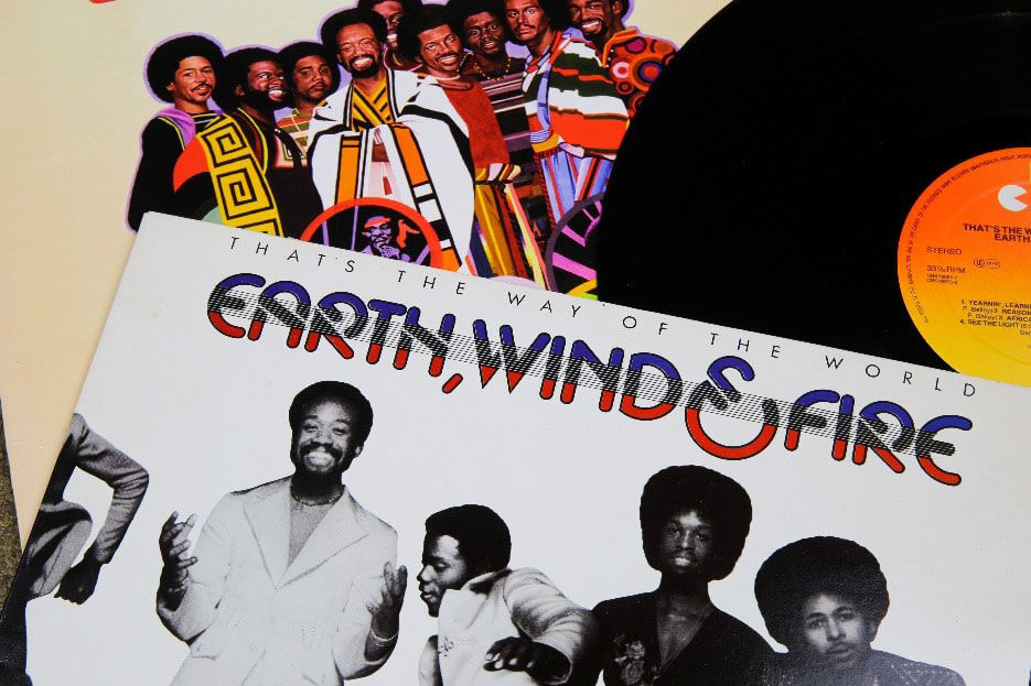A cover from the record That's The Way of the World by the band Earth, Wind, and Fire with the record pulled out of the case