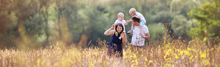 Family of 4 in a field